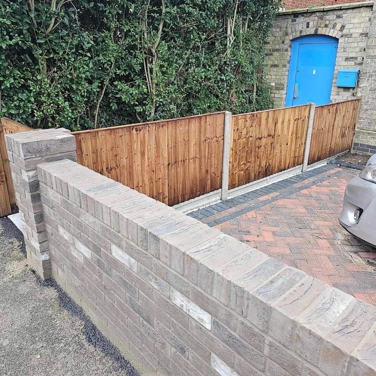 New brick wall, fencing and block paving