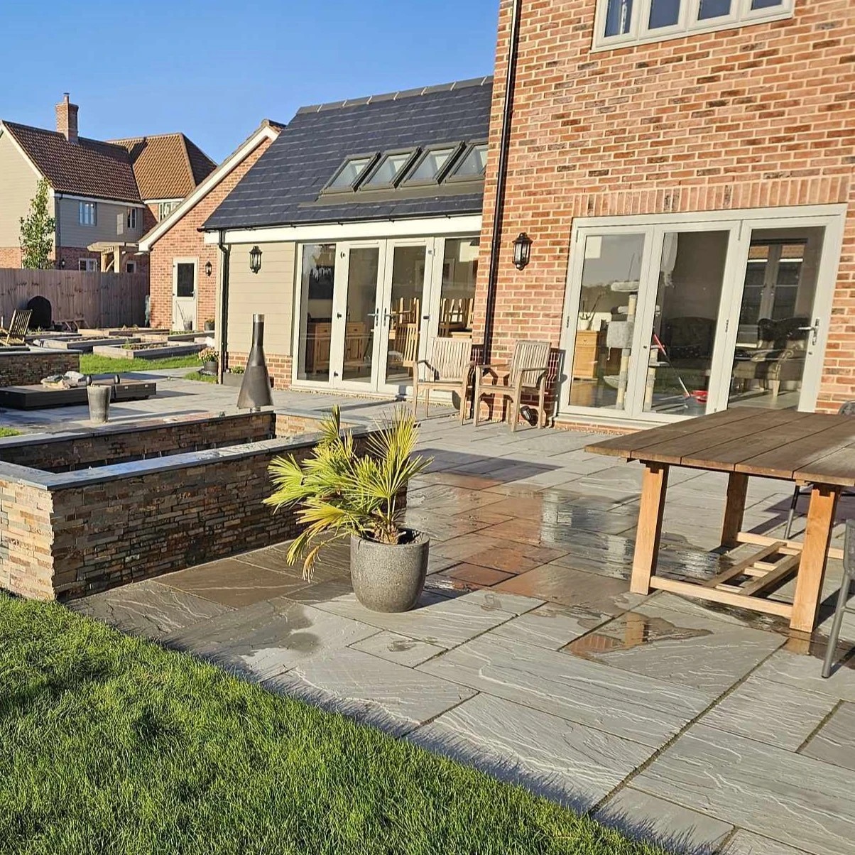 Sandstone patio with stone clad water feature